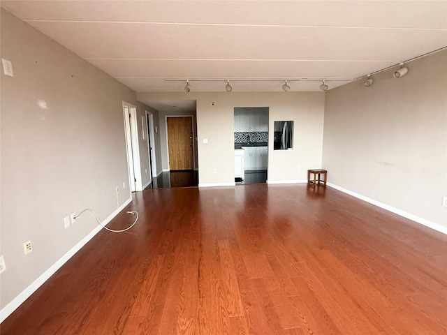 701 Pelham Rd Unit 2E, New Rochelle, NY 10805 - spare room with rail lighting and wood finished floors