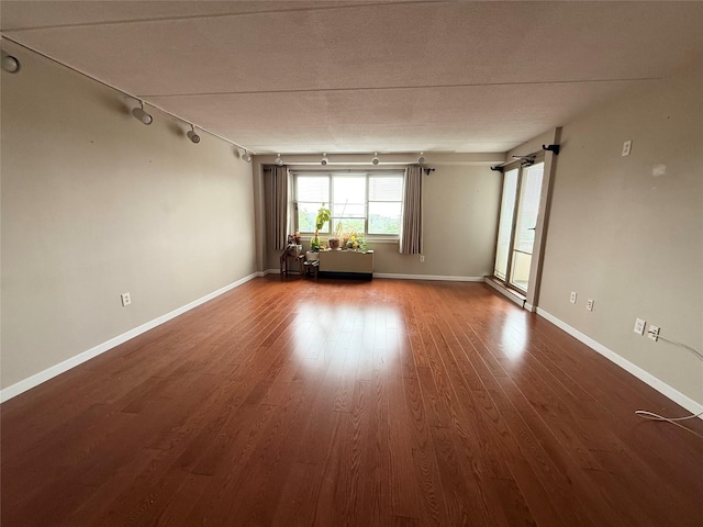 701 Pelham Rd Unit 2E, New Rochelle, NY 10805 - spare room featuring track lighting and wood finished floors