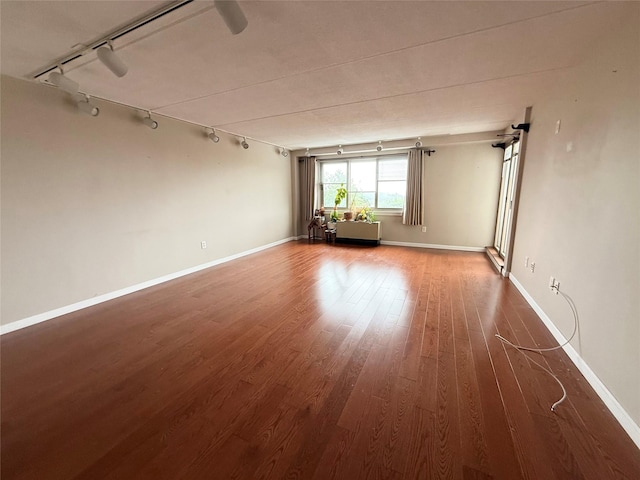 701 Pelham Rd Unit 2E, New Rochelle, NY 10805 - unfurnished room featuring rail lighting and wood finished floors