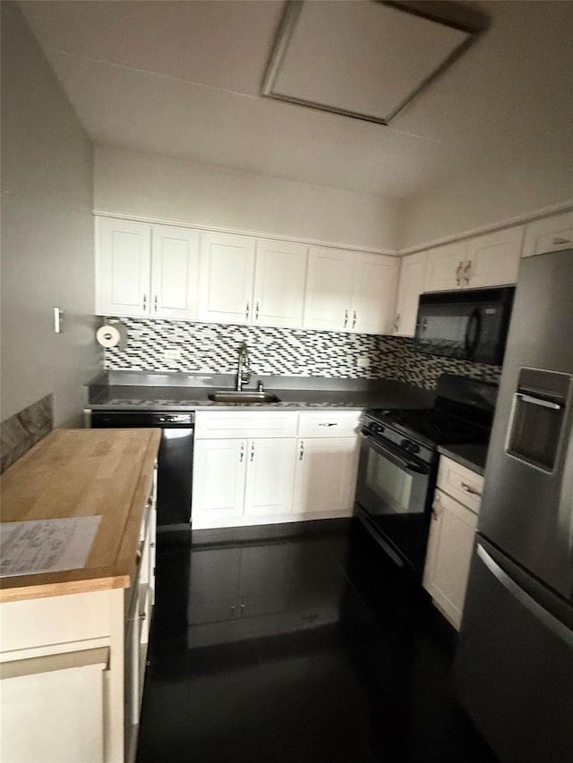 701 Pelham Rd Unit 2E, New Rochelle, NY 10805 - kitchen featuring black appliances, tasteful backsplash, and white cabinetry