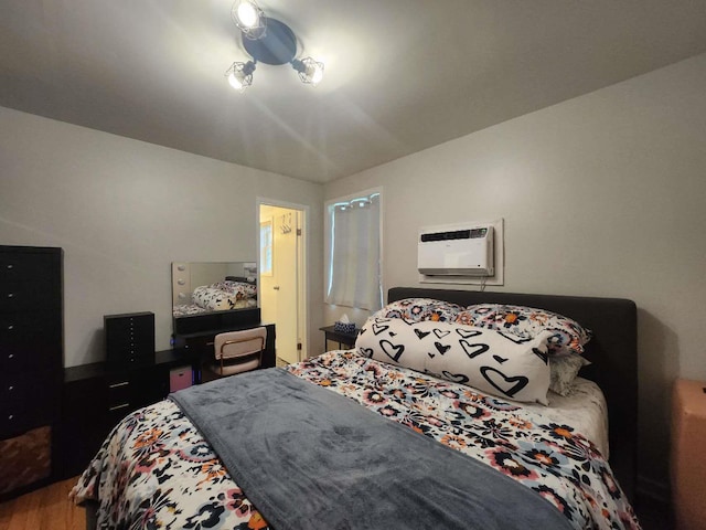 64-15 Springfield Blvd Unit A, Oakland Gardens, NY 11364 - bedroom featuring wood finished floors and a wall mounted air conditioner