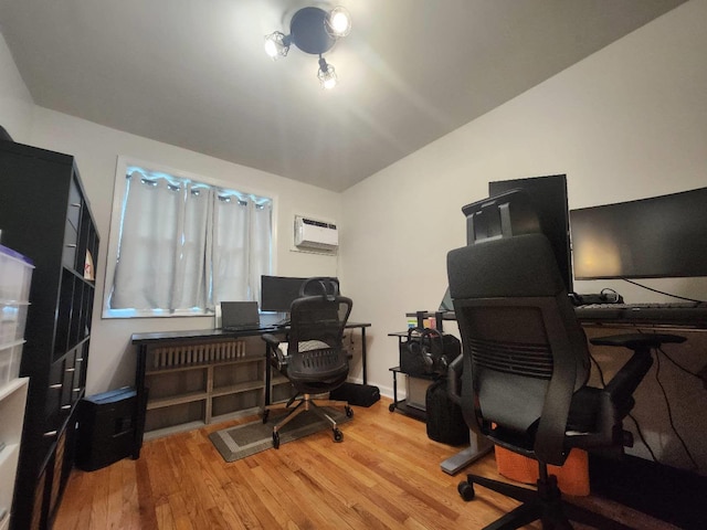 64-15 Springfield Blvd Unit A, Oakland Gardens, NY 11364 - home office featuring a wall unit AC and wood finished floors