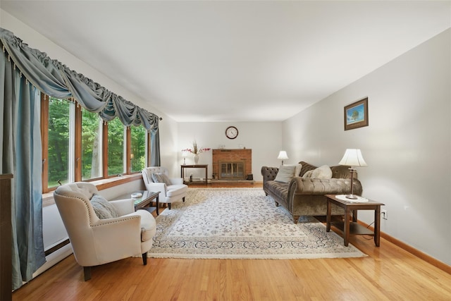 99 Furnace Dock Rd, Croton-On-Hudson, NY 10520 - living area featuring wood finished floors, a fireplace, and baseboards