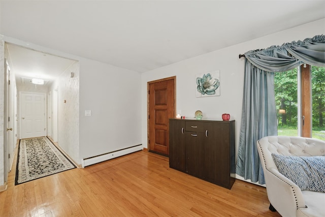 99 Furnace Dock Rd, Croton-On-Hudson, NY 10520 - bedroom with baseboard heating, light wood-style floors, and attic access