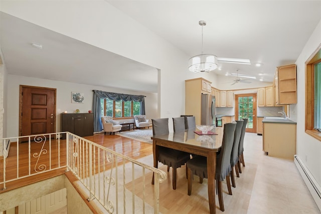 99 Furnace Dock Rd, Croton-On-Hudson, NY 10520 - dining area with baseboard heating, ceiling fan, vaulted ceiling, and a chandelier