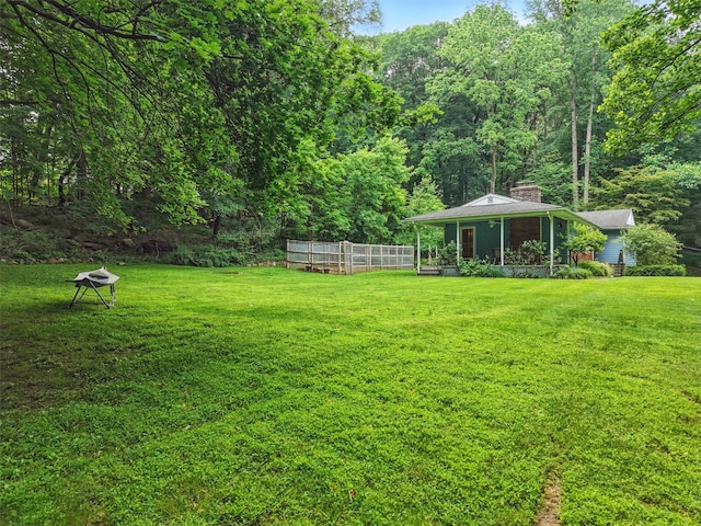 99 Furnace Dock Rd, Croton-On-Hudson, NY 10520 - view of green lawn featuring a greenhouse, an outbuilding, and a forest view