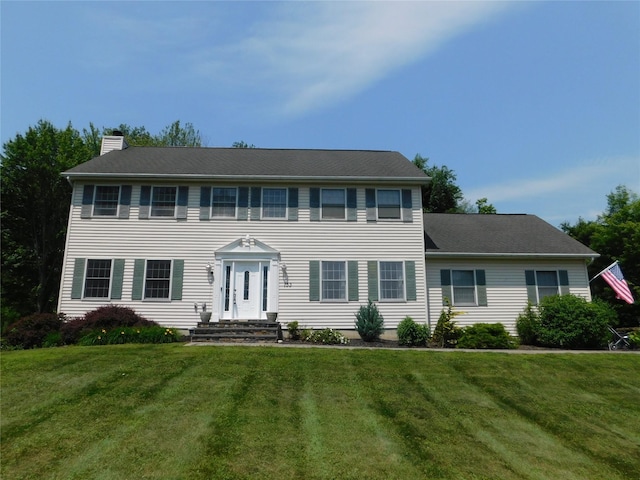 133 Lattintown Rd, Newburgh, NY 12550 - colonial home featuring a chimney and a front yard