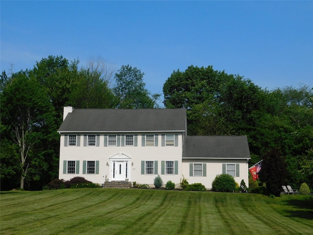 133 Lattintown Rd, Newburgh, NY 12550 - colonial inspired home with a chimney and a front lawn