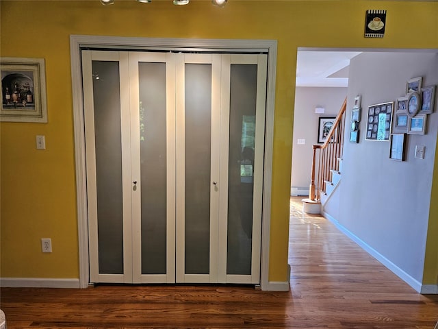 133 Lattintown Rd, Newburgh, NY 12550 - corridor with wood finished floors and stairs