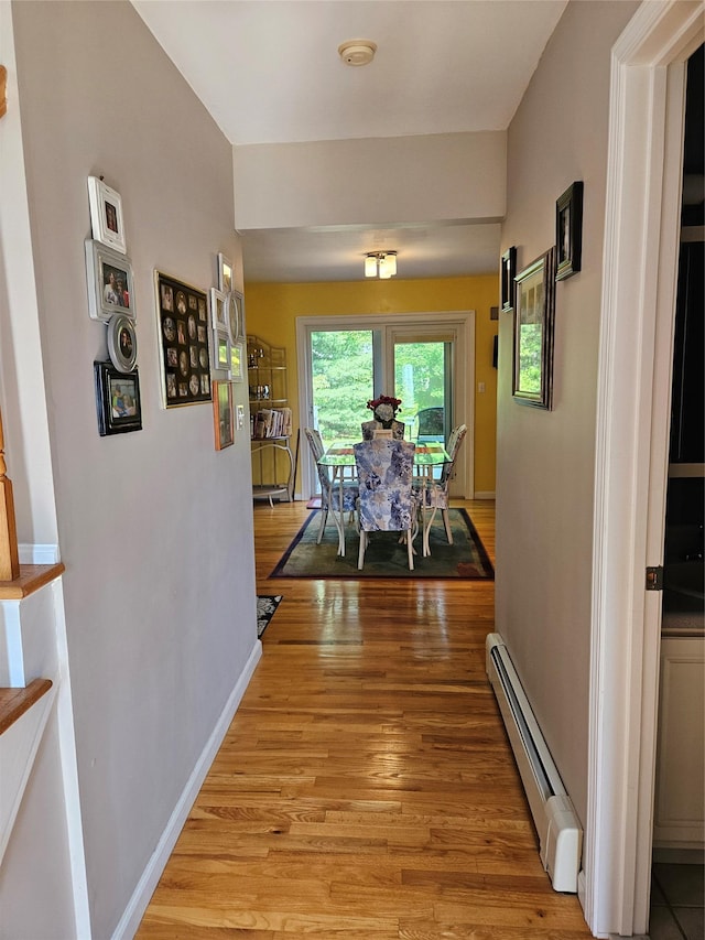 133 Lattintown Rd, Newburgh, NY 12550 - corridor featuring baseboard heating and light wood-style floors
