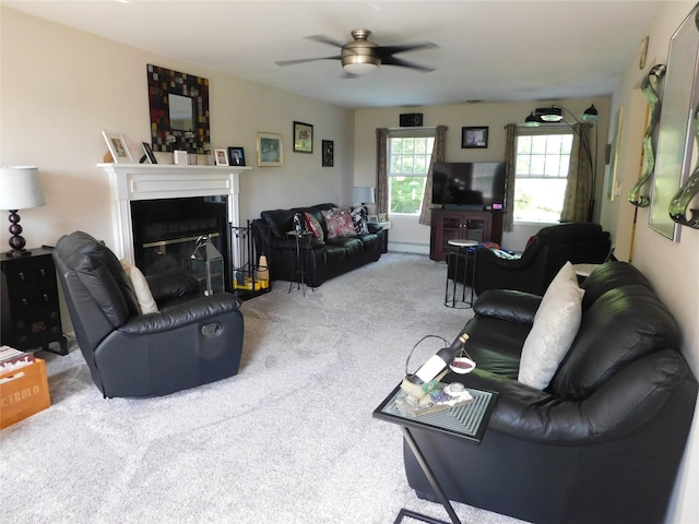 133 Lattintown Rd, Newburgh, NY 12550 - carpeted living room with a ceiling fan and a glass covered fireplace