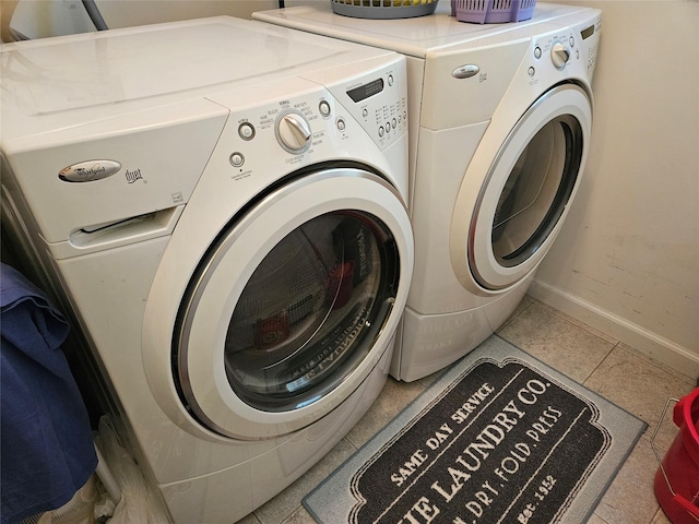133 Lattintown Rd, Newburgh, NY 12550 - washroom with separate washer and dryer and tile patterned floors