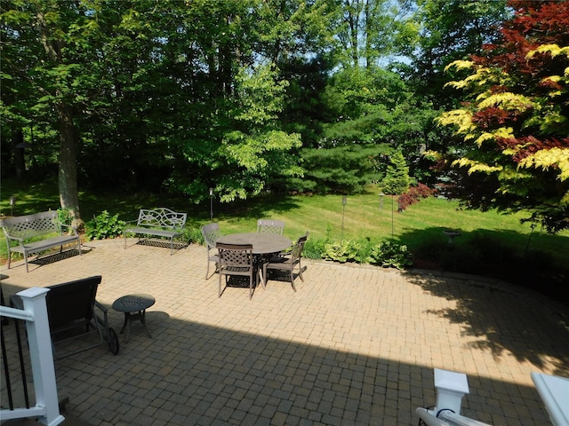 133 Lattintown Rd, Newburgh, NY 12550 - view of patio with outdoor dining area and view of wooded area