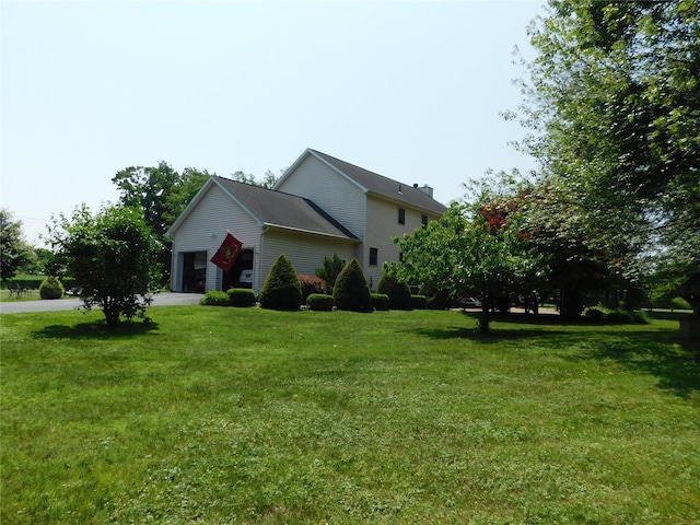 133 Lattintown Rd, Newburgh, NY 12550 - view of property exterior with a yard, concrete driveway, and a garage