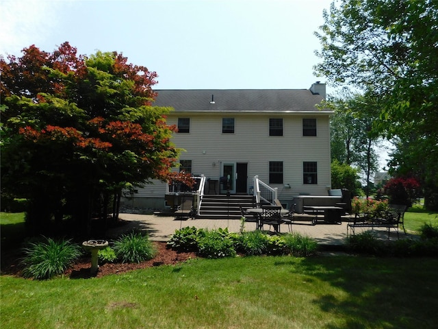 133 Lattintown Rd, Newburgh, NY 12550 - rear view of property with a patio area, a chimney, and a yard