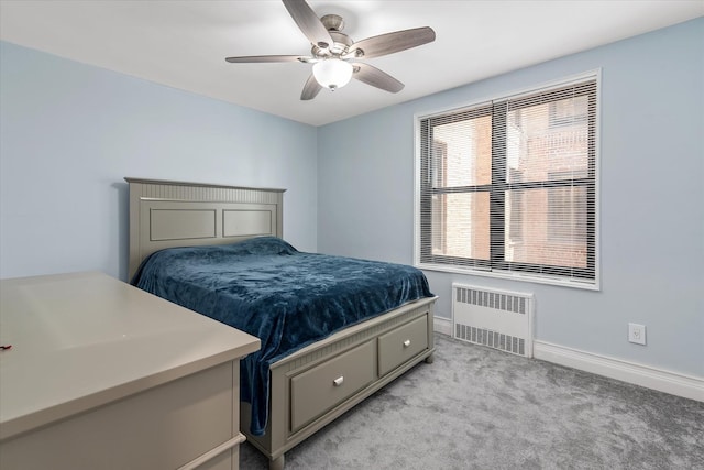 83-30 98th St Unit 5A, Woodhaven, NY 11421 - bedroom featuring radiator heating unit, light colored carpet, baseboards, and ceiling fan