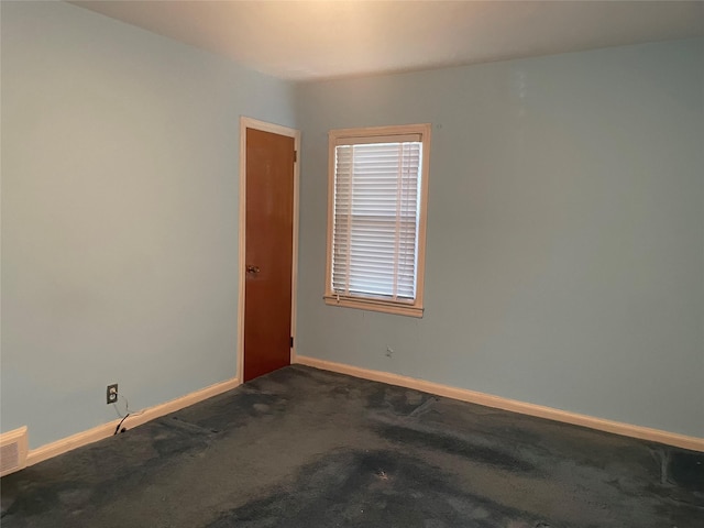 4 New Hyde Park Rd, New Hyde Park, NY 11040 - empty room featuring baseboards and dark carpet