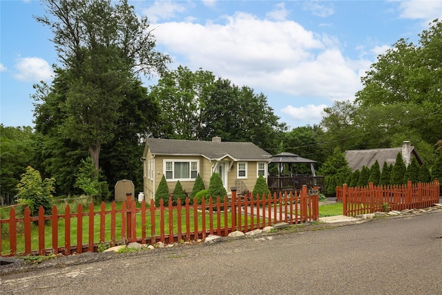 33 Hollowbrook Ct N, Cortlandt Manor, NY 10567 - view of front facade featuring a gazebo, a fenced front yard, and a chimney