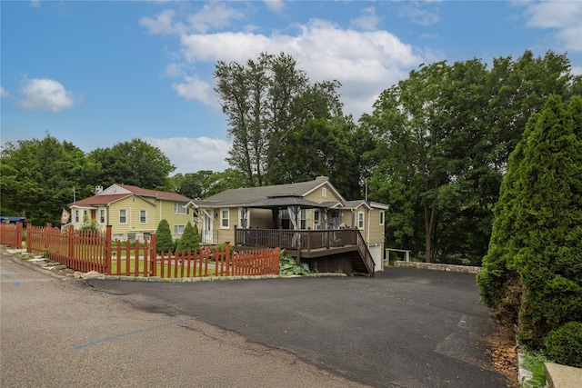33 Hollowbrook Ct N, Cortlandt Manor, NY 10567 - view of front of property with a fenced front yard and a deck