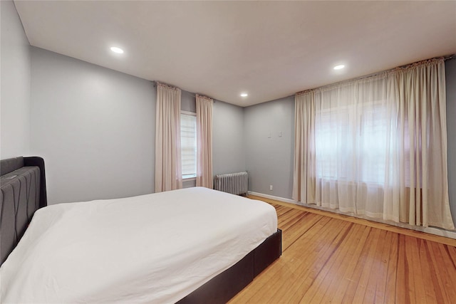 33 Hollowbrook Ct N, Cortlandt Manor, NY 10567 - bedroom with radiator, light wood finished floors, and recessed lighting