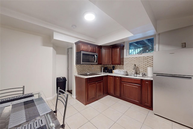 33 Hollowbrook Ct N, Cortlandt Manor, NY 10567 - kitchen with stainless steel appliances, light countertops, tasteful backsplash, and light tile patterned floors
