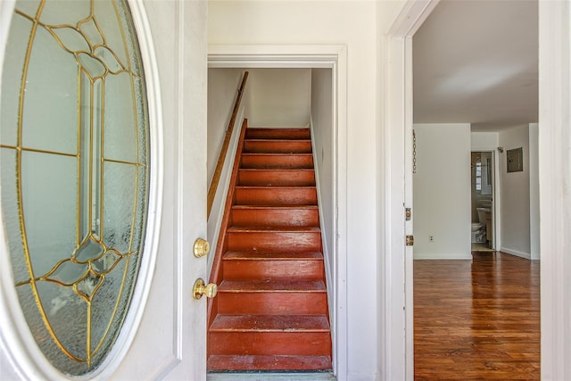 39-32 54th St, Woodside, NY 11377 - stairs featuring wood finished floors and baseboards