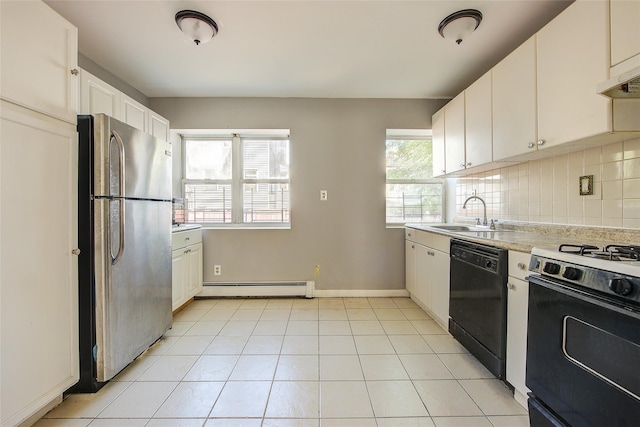 39-32 54th St, Woodside, NY 11377 - kitchen with black dishwasher, freestanding refrigerator, gas stove, a baseboard heating unit, and a sink
