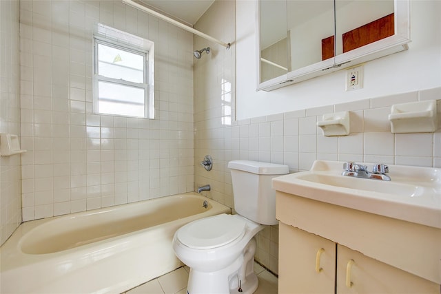39-32 54th St, Woodside, NY 11377 - bathroom with tile walls, shower / washtub combination, toilet, and vanity