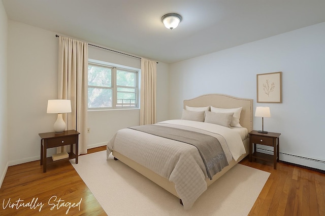 39-32 54th St, Woodside, NY 11377 - bedroom featuring wood finished floors and baseboards