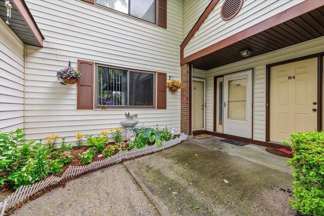 615 Broadway Unit 85, Amityville, NY 11701 - view of exterior entry featuring a patio