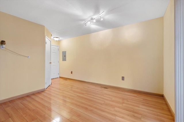 615 Broadway Unit 85, Amityville, NY 11701 - unfurnished room with electric panel and light wood finished floors