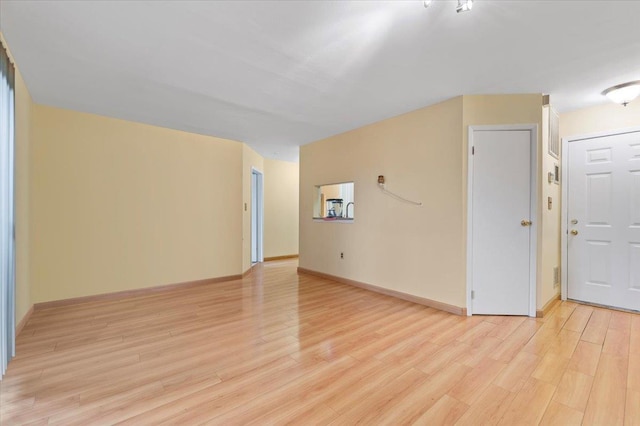 615 Broadway Unit 85, Amityville, NY 11701 - unfurnished room featuring light wood finished floors and baseboards