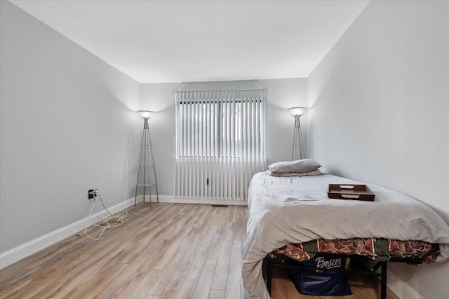 615 Broadway Unit 85, Amityville, NY 11701 - bedroom with wood finished floors and baseboards