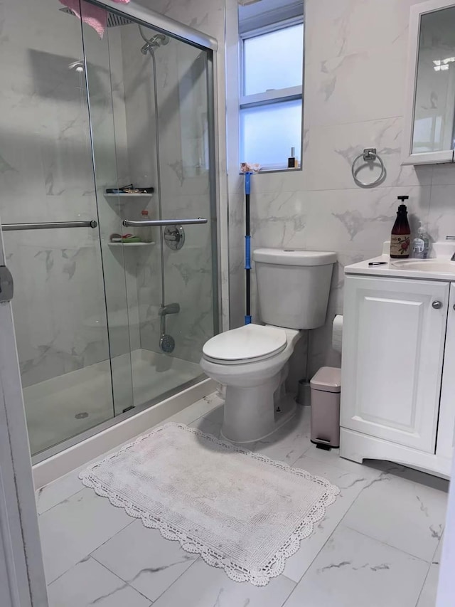 125-03 13th Ave, College Point, NY 11356 - full bath featuring marble look tiles, toilet, vanity, and a shower stall