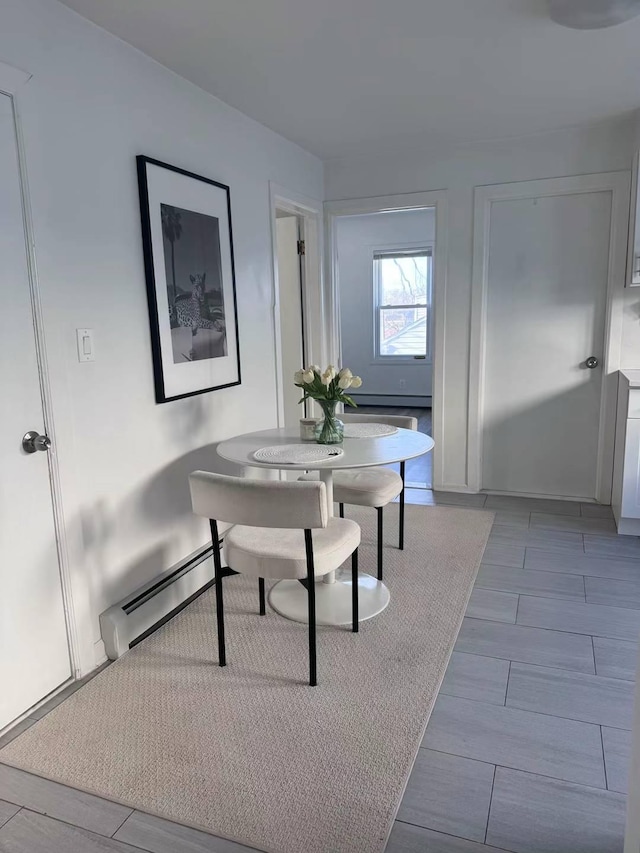 125-03 13th Ave, College Point, NY 11356 - dining area with baseboard heating and wood tiled floors