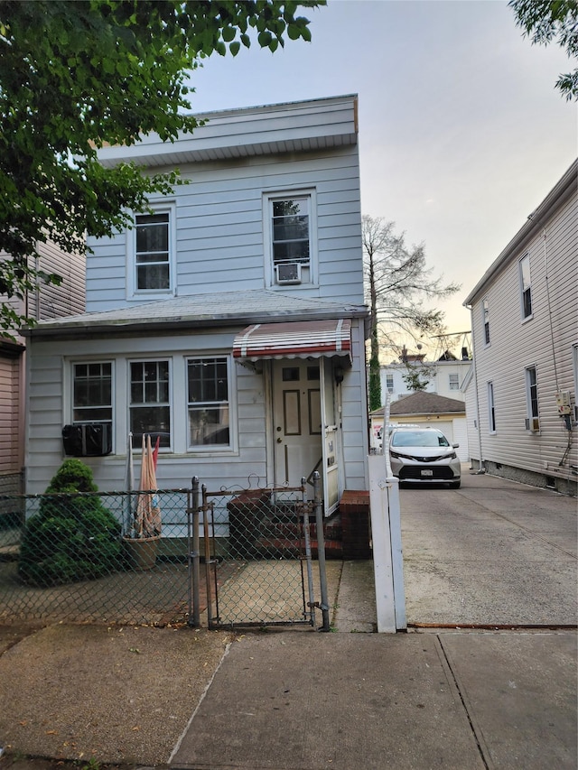 94-34 116th St, Richmond Hill, NY 11419 - view of front of home featuring a fenced front yard, a gate, and cooling unit