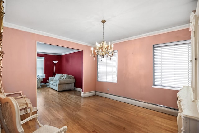 10 Marlan Ct, Smithtown, NY 11787 - sitting room with a baseboard radiator, wood finished floors, ornamental molding, and a chandelier