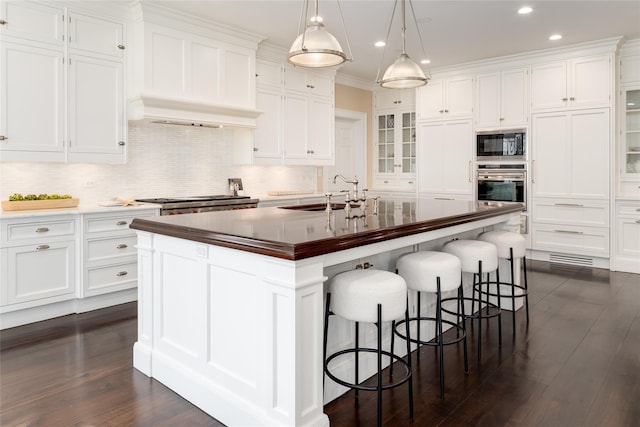 21 Dorann Rd, Purchase, NY 10577 - kitchen featuring stainless steel appliances, recessed lighting, white cabinetry, glass insert cabinets, and crown molding