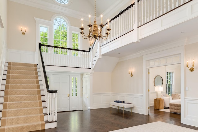 21 Dorann Rd, Purchase, NY 10577 - entrance foyer with a decorative wall, wainscoting, stairway, ornamental molding, and a chandelier