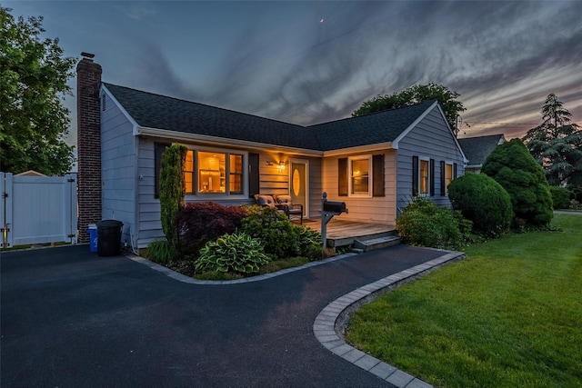 10 Bradish Ln, Babylon, NY 11702 - ranch-style house featuring a chimney and a shingled roof