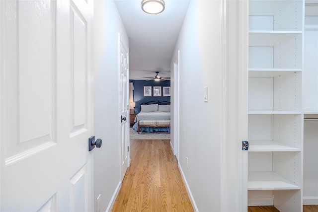 10 Bradish Ln, Babylon, NY 11702 - corridor with light wood-style flooring and baseboards