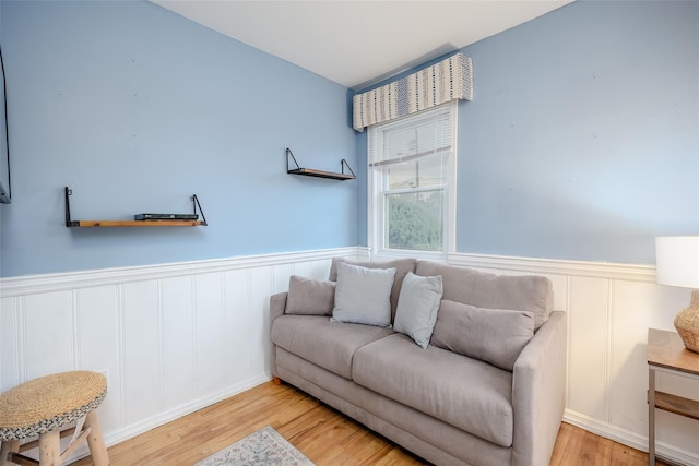 10 Bradish Ln, Babylon, NY 11702 - sitting room featuring wainscoting, wood finished floors, and a decorative wall