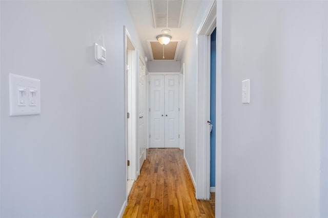 10 Bradish Ln, Babylon, NY 11702 - corridor with attic access and light wood-style floors