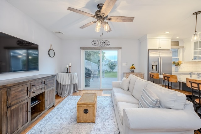 10 Bradish Ln, Babylon, NY 11702 - living room featuring light wood-style flooring, a ceiling fan, and recessed lighting