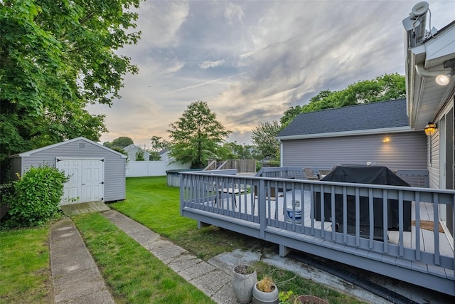 10 Bradish Ln, Babylon, NY 11702 - fenced backyard with a storage unit and a wooden deck