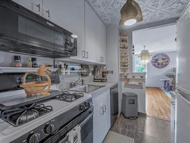 241-20 Northern Blvd Unit 6J, Little Neck, NY 11362 - kitchen featuring range with gas cooktop, dishwasher, light countertops, white cabinets, and black microwave
