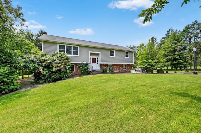 169 Rte 118, Yorktown Heights, NY 10598 - back of house featuring a yard, a chimney, and brick siding