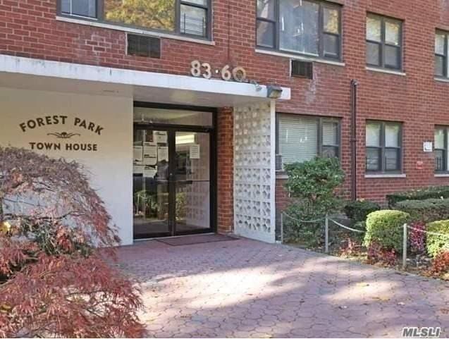83-60 118th St Unit 7K, Kew Gardens, NY 11415 - entrance to property with brick siding and french doors