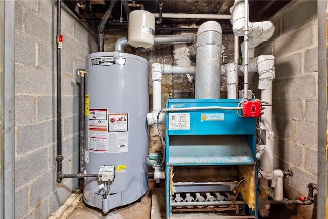 1180 Grant Ave, Bronx, NY 10456 - utility room featuring water heater
