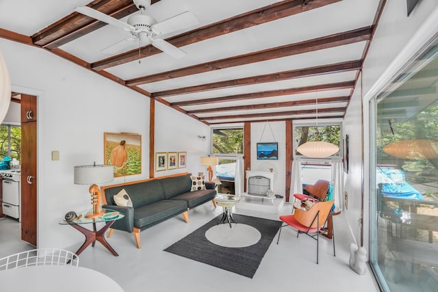284 Bay Walk, Fire Island Pines, NY 11782 - living area featuring healthy amount of natural light, beam ceiling, a ceiling fan, and tile patterned floors